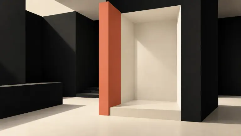 A warm ivory shower alcove framed by dark architectural planes, with a muted coral vertical wall marking a repair boundary.